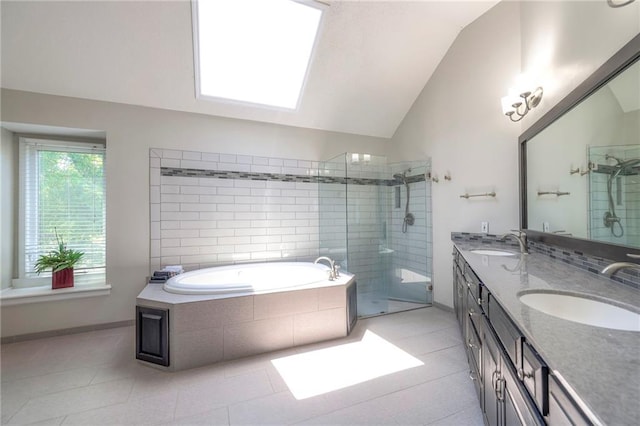 8355 Hallet St, Lenexa, KS 66215 - full bath featuring lofted ceiling, tiled shower, double vanity, a garden tub, and tile patterned flooring