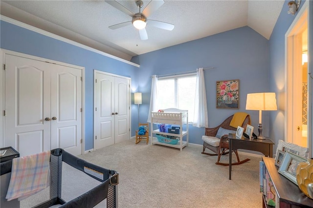 8355 Hallet St, Lenexa, KS 66215 - bedroom featuring multiple closets, carpet, lofted ceiling, and ceiling fan