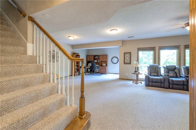 8355 Hallet St, Lenexa, KS 66215 - stairs featuring carpet flooring, a textured ceiling, and a ceiling fan