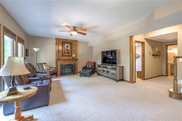 8355 Hallet St, Lenexa, KS 66215 - living area featuring ceiling fan, light carpet, and a fireplace