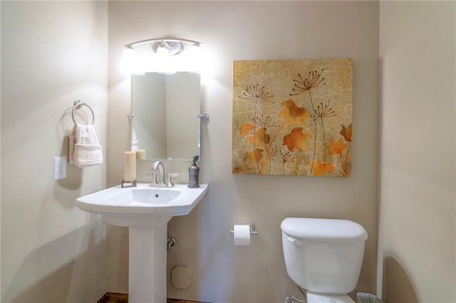 8355 Hallet St, Lenexa, KS 66215 - half bathroom with toilet and a sink