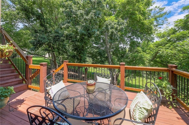 8355 Hallet St, Lenexa, KS 66215 - wooden deck with outdoor dining space and stairway
