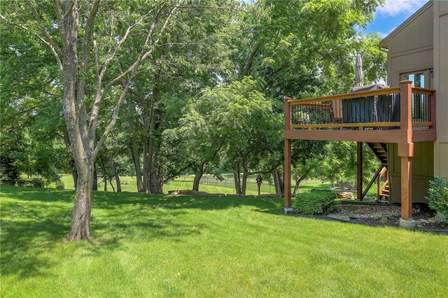 8355 Hallet St, Lenexa, KS 66215 - view of green lawn with stairway and a deck