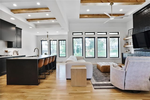 1245 NE Goshen Dr, Lees Summit, MO 64064 - living area featuring beam ceiling, light wood-style flooring, a chandelier, and recessed lighting