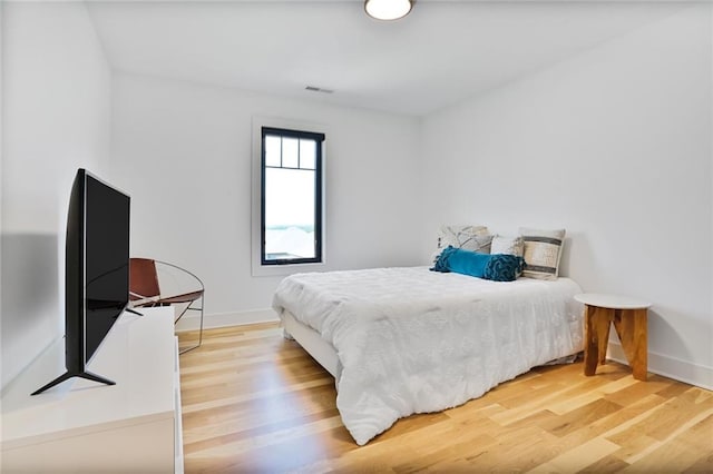 1245 NE Goshen Dr, Lees Summit, MO 64064 - bedroom featuring wood finished floors