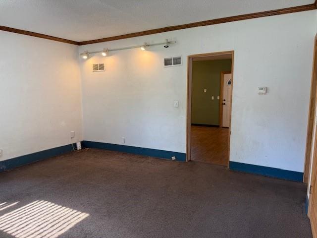 313 Shawnee St, Hiawatha, KS 66434 - spare room featuring ornamental molding, carpet flooring, and baseboards