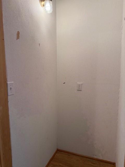 313 Shawnee St, Hiawatha, KS 66434 - unfurnished room with wood finished floors and baseboards