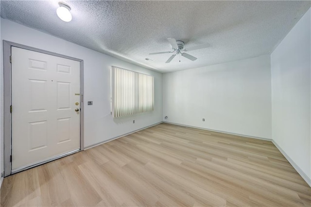 11321 W 77th Ter, Overland Park, KS 66214 - entrance foyer with light wood-type flooring, a textured ceiling, and ceiling fan