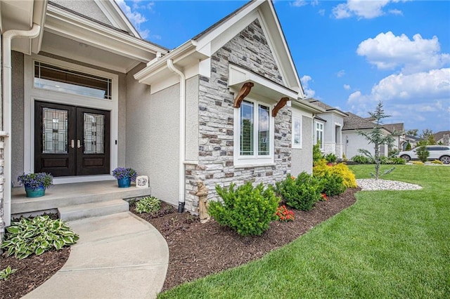 130 NW Ambersham Dr, Lees Summit, MO 64081 - doorway to property with french doors, stone siding, a yard, and stucco siding