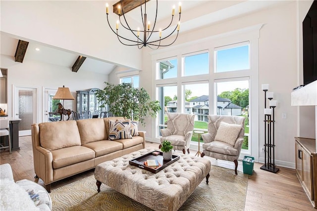 130 NW Ambersham Dr, Lees Summit, MO 64081 - living room with high vaulted ceiling, beamed ceiling, a chandelier, light wood-style flooring, and recessed lighting