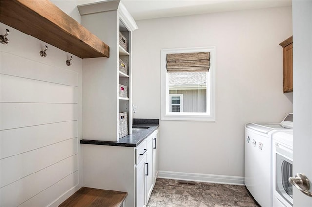 130 NW Ambersham Dr, Lees Summit, MO 64081 - laundry room with washing machine and clothes dryer and cabinet space