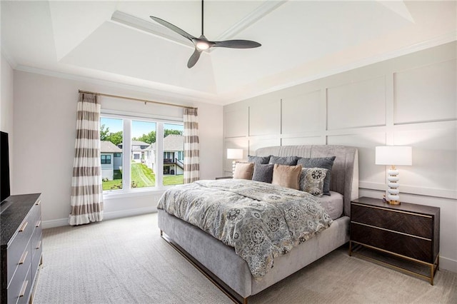 130 NW Ambersham Dr, Lees Summit, MO 64081 - bedroom featuring a raised ceiling, light colored carpet, ornamental molding, ceiling fan, and a decorative wall