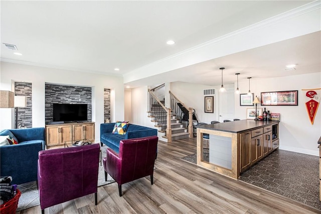 130 NW Ambersham Dr, Lees Summit, MO 64081 - living room featuring stairway, ornamental molding, dark wood-style floors, and recessed lighting