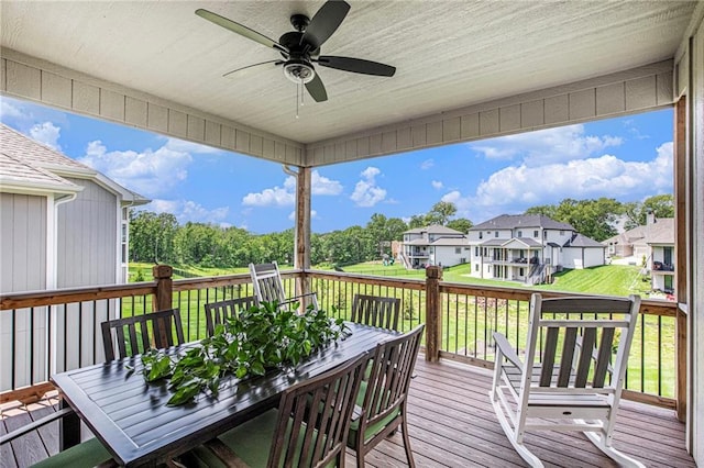 130 NW Ambersham Dr, Lees Summit, MO 64081 - deck featuring outdoor dining space, ceiling fan, a residential view, and a yard