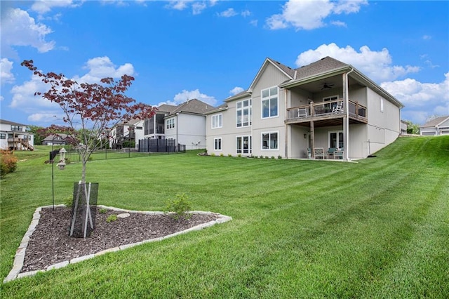 130 NW Ambersham Dr, Lees Summit, MO 64081 - back of property featuring a ceiling fan, a balcony, and a residential view