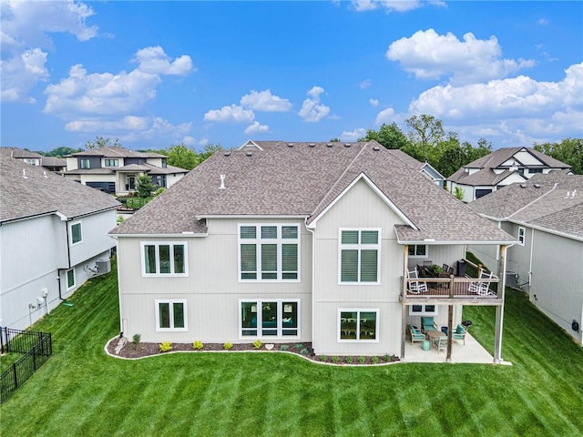 130 NW Ambersham Dr, Lees Summit, MO 64081 - rear view of property featuring a patio, a shingled roof, and a residential view