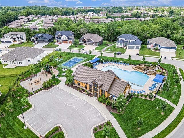 130 NW Ambersham Dr, Lees Summit, MO 64081 - aerial perspective of suburban area featuring a pool