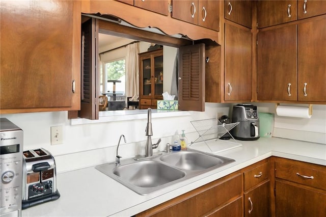 9643 Y Rd, Meriden, KS 66512 - kitchen with light countertops and brown cabinets