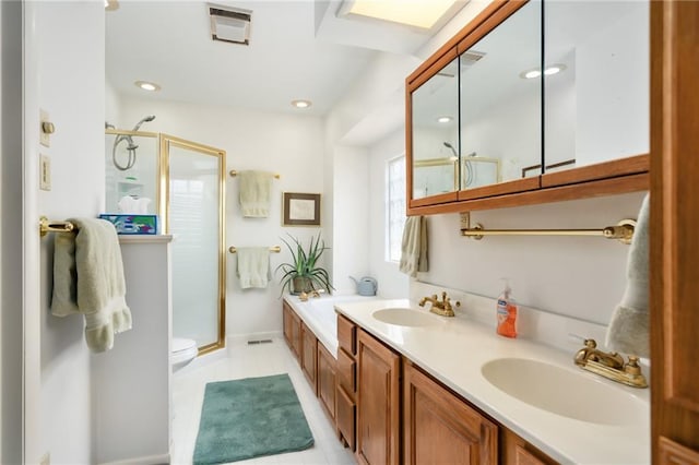 9643 Y Rd, Meriden, KS 66512 - bathroom featuring a shower stall, double vanity, recessed lighting, and tile patterned floors