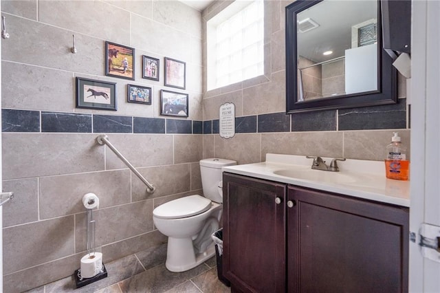 9643 Y Rd, Meriden, KS 66512 - full bathroom with tile walls, tiled shower, and vanity
