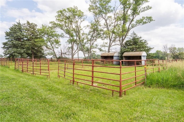 9643 Y Rd, Meriden, KS 66512 - view of yard with an outdoor structure, a view of countryside, and an exterior structure
