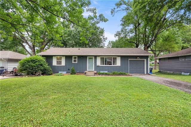 4510 E 113th St, Kansas City, MO 64137 - single story home featuring a garage, asphalt driveway, a front yard, board and batten siding, and entry steps