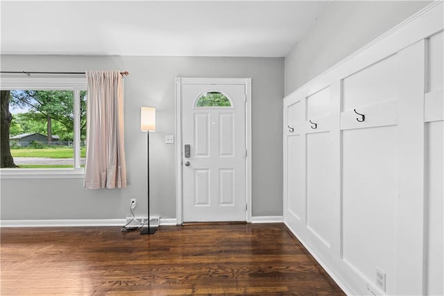 4510 E 113th St, Kansas City, MO 64137 - foyer with dark wood-style flooring and baseboards