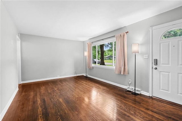 4510 E 113th St, Kansas City, MO 64137 - foyer entrance with plenty of natural light and dark wood finished floors