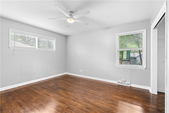 4510 E 113th St, Kansas City, MO 64137 - unfurnished room with dark wood-style flooring and ceiling fan