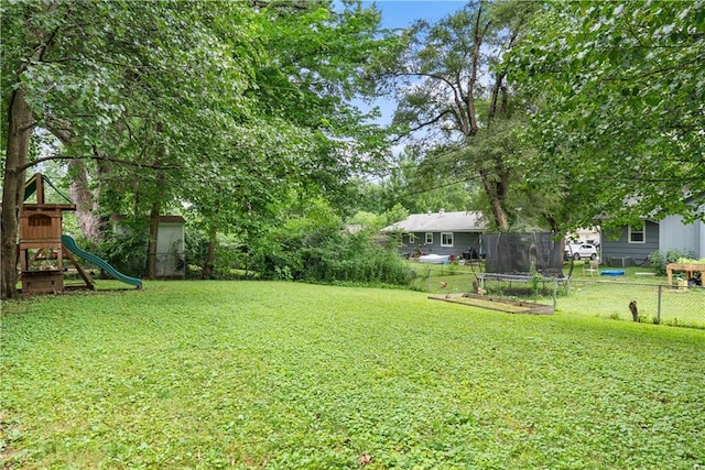 4510 E 113th St, Kansas City, MO 64137 - view of yard with a playground