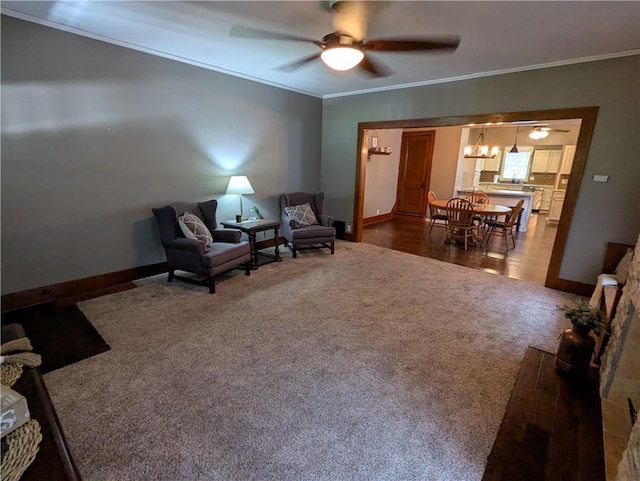1208 Central Ave, Horton, KS 66439 - living area featuring dark carpet, ceiling fan, crown molding, and a chandelier