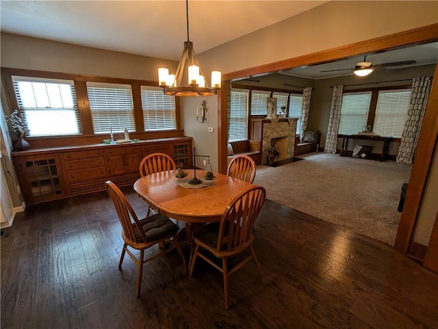 1208 Central Ave, Horton, KS 66439 - dining space with dark wood-style floors, a high end fireplace, and a chandelier