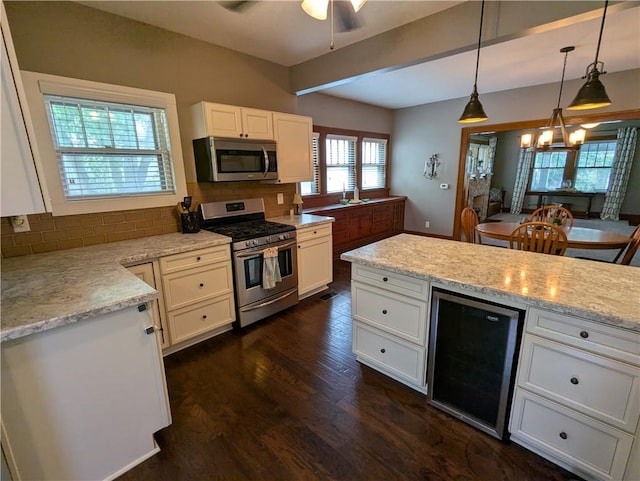 1208 Central Ave, Horton, KS 66439 - kitchen featuring stainless steel appliances, beverage cooler, dark wood finished floors, and decorative backsplash