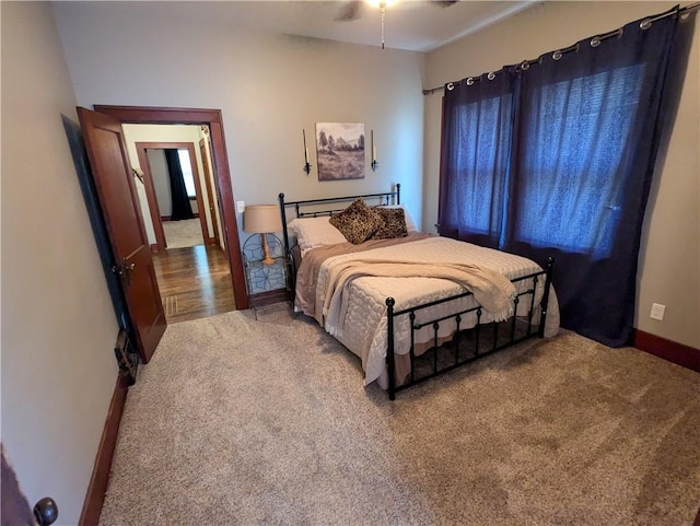 1208 Central Ave, Horton, KS 66439 - carpeted bedroom with baseboards and ceiling fan
