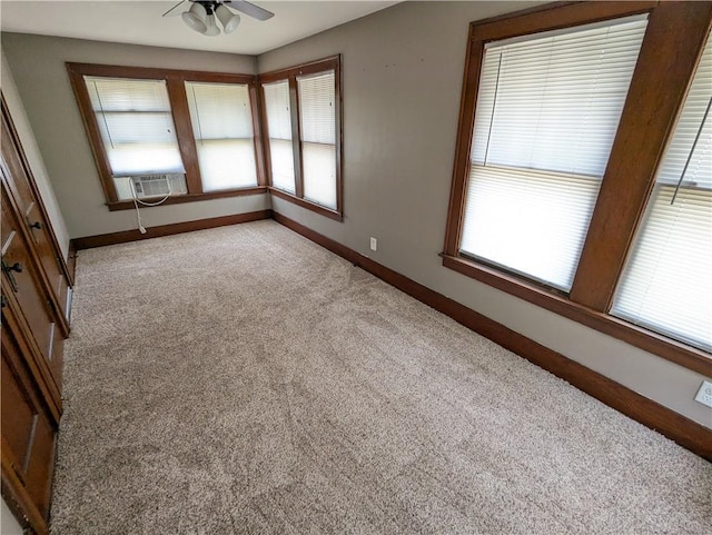 1208 Central Ave, Horton, KS 66439 - unfurnished room with plenty of natural light, light colored carpet, a ceiling fan, and cooling unit