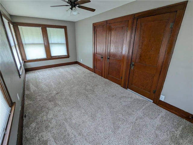 1208 Central Ave, Horton, KS 66439 - unfurnished bedroom with carpet floors, a closet, and ceiling fan