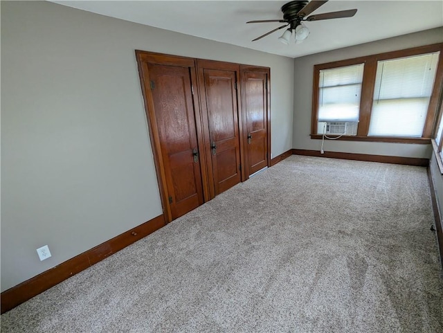 1208 Central Ave, Horton, KS 66439 - unfurnished bedroom featuring carpet floors, cooling unit, a closet, and a ceiling fan