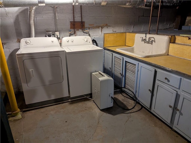 1208 Central Ave, Horton, KS 66439 - laundry room featuring washing machine and clothes dryer and cabinet space
