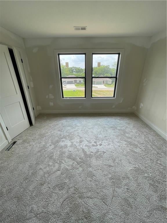 1824 Arbor Trl, Liberty, MO 64068 - empty room with plenty of natural light and carpet floors