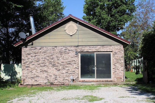 42 Driftwood Ln, Linn Valley, KS 66040 - back of property with brick siding