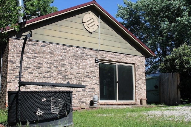 42 Driftwood Ln, Linn Valley, KS 66040 - back of house featuring brick siding