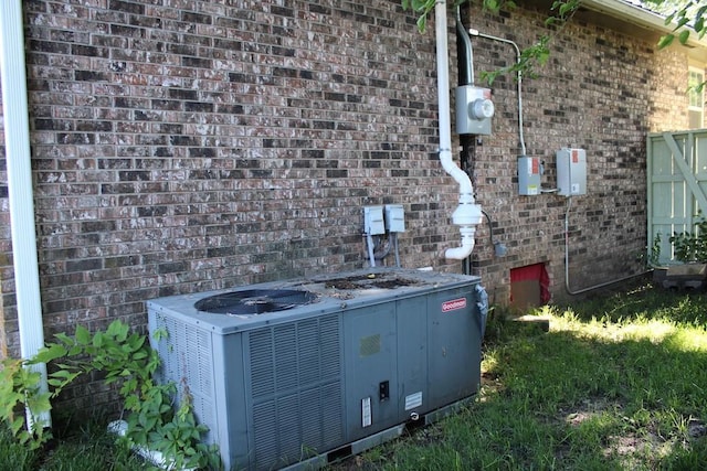 42 Driftwood Ln, Linn Valley, KS 66040 - exterior view of central AC unit, brick siding, and electric meter