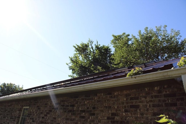 42 Driftwood Ln, Linn Valley, KS 66040 - exterior view of brick siding and gutters