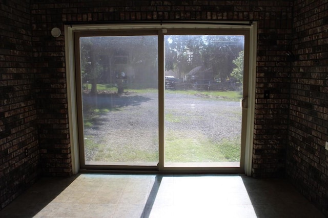 42 Driftwood Ln, Linn Valley, KS 66040 - doorway to outside featuring brick wall