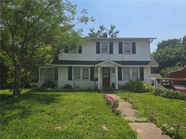 9521 E 13th St S, Independence, MO 64052 - view of front of home featuring a front lawn and a chimney