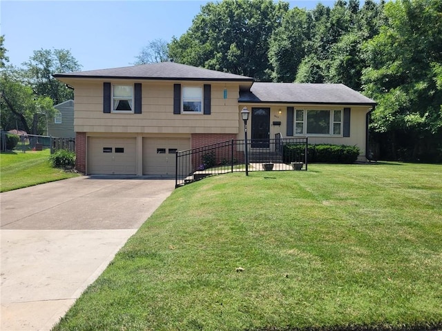 8603 E 85th St, Raytown, MO 64138 - split level home featuring a garage, brick siding, and driveway