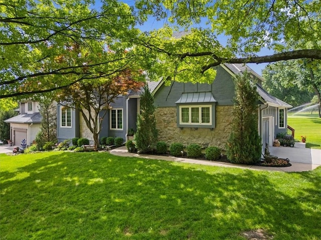 12600 Wenonga Ln, Leawood, KS 66209 - obstructed view of property featuring stone siding, a front yard, a standing seam roof, and stucco siding