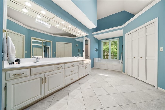 12600 Wenonga Ln, Leawood, KS 66209 - bathroom with double vanity, ornamental molding, recessed lighting, tile patterned flooring, and lofted ceiling