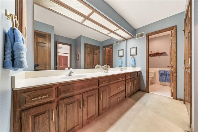 12600 Wenonga Ln, Leawood, KS 66209 - full bathroom with double vanity and toilet