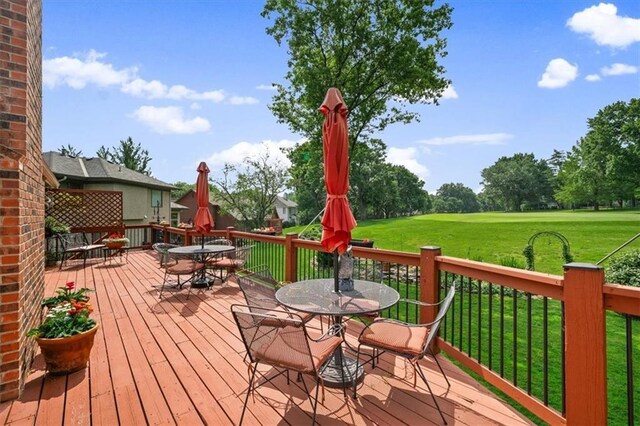 12600 Wenonga Ln, Leawood, KS 66209 - wooden terrace with outdoor dining area and a yard